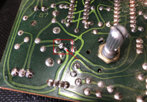 A close up of a circuit board with a few screws on it.